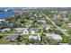 Aerial view of a single-Gathering home with a large backyard, located in a residential neighborhood at 1648 Idle Ln, Sarasota, FL 34231