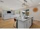 Open concept kitchen with island, stainless steel appliances, and granite countertops at 17015 Harvest Moon Way, Bradenton, FL 34211