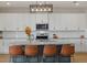 Modern kitchen with island and white cabinets at 17015 Harvest Moon Way, Bradenton, FL 34211
