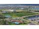 Aerial view of community with lake, pool, and homes at 17015 Harvest Moon Way, Bradenton, FL 34211