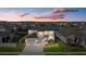 Two-story house with a three-car garage, well-landscaped front yard at 17015 Harvest Moon Way, Bradenton, FL 34211