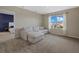 Spacious bonus room with a sectional sofa and a view of the backyard at 17015 Harvest Moon Way, Bradenton, FL 34211