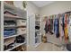 Spacious walk-in closet with shelving and hanging rods at 17015 Harvest Moon Way, Bradenton, FL 34211