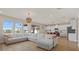 Spacious living room with sectional sofa and view of pool at 17015 Harvest Moon Way, Bradenton, FL 34211