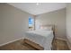 Bright bedroom with a double bed and a window offering a pleasant view at 17015 Harvest Moon Way, Bradenton, FL 34211