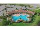 Community pool with covered patio and ample lounge chairs at 17015 Harvest Moon Way, Bradenton, FL 34211