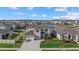 Two-story house with a three-car garage, well-landscaped front yard at 17015 Harvest Moon Way, Bradenton, FL 34211