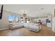 Open concept living room with kitchen and large sectional sofa at 17015 Harvest Moon Way, Bradenton, FL 34211