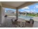 Covered patio with seating area overlooking the pool at 17015 Harvest Moon Way, Bradenton, FL 34211