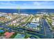 Aerial view of waterfront community with boat docks and tennis courts at 208 Lewis Cir # 4A, Punta Gorda, FL 33950