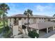 Two-story condo building with Spanish tile roof and carport at 208 Lewis Cir # 4A, Punta Gorda, FL 33950