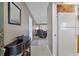 Bright condo entryway with view of living room and kitchen at 208 Lewis Cir # 4A, Punta Gorda, FL 33950