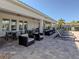 Spacious pool patio with comfortable seating and shade at 225 Daylily Blvd, Nokomis, FL 34275