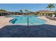 Freeform community pool with plenty of lounge chairs at 225 Daylily Blvd, Nokomis, FL 34275