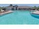 Inviting community pool with lounge chairs and a clubhouse at 225 Daylily Blvd, Nokomis, FL 34275