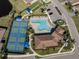 Community pool, pickleball courts, and clubhouse are featured in this aerial view at 225 Daylily Blvd, Nokomis, FL 34275