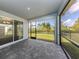 Screened patio with paver floor and backyard access at 225 Daylily Blvd, Nokomis, FL 34275