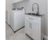Laundry room with washer, dryer, and utility sink at 225 Daylily Blvd, Nokomis, FL 34275
