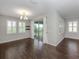 Bright dining room with hardwood floors and sliding glass doors to patio at 225 Daylily Blvd, Nokomis, FL 34275