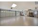 Large garage with epoxy flooring and ample storage at 3017 Wilderness E Blvd, Parrish, FL 34219