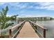 Wooden dock extending over calm lake water at 3532 Lake Bayshore Dr # K117, Bradenton, FL 34205