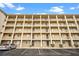 Condo building exterior showcasing multiple units and parking at 3532 Lake Bayshore Dr # K117, Bradenton, FL 34205