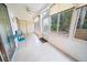 Sunroom with tiled floors, windows, and sliding glass doors at 3532 Lake Bayshore Dr # K117, Bradenton, FL 34205