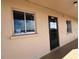 Exterior view of condo building showcasing condo unit entrance and windows at 3993 Lake Bayshore Dr # F513, Bradenton, FL 34205