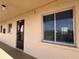 Exterior view of condo building showing condo unit entrance and windows at 3993 Lake Bayshore Dr # F513, Bradenton, FL 34205