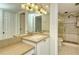 Updated bathroom with double vanity and a walk-in shower at 5770 Midnight Pass Rd # 301, Sarasota, FL 34242