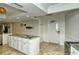 Modern kitchen with white cabinets and granite countertops at 5770 Midnight Pass Rd # 301, Sarasota, FL 34242