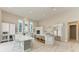 Modern kitchen with white cabinets, stainless steel appliances, and a large island at 5910 Red Mangrove Ln, Bradenton, FL 34210