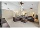 Spacious living room featuring a large sectional sofa and ample natural light at 6223 90Th Avenue E Cir, Parrish, FL 34219