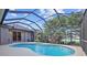 Relaxing screened pool and spa with a covered lanai at 6223 90Th Avenue E Cir, Parrish, FL 34219