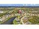Wide aerial view showing the home's location within a neighborhood near a lake at 6223 90Th Avenue E Cir, Parrish, FL 34219
