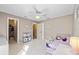 Charming bedroom with a pink bed, toy area, and direct access to a closet at 6223 90Th Avenue E Cir, Parrish, FL 34219
