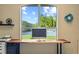 Home office features a large window with a lake view and a spacious wood desk at 6223 90Th Avenue E Cir, Parrish, FL 34219