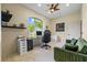 Bright home office with large window, desk, and green couch at 6223 90Th Avenue E Cir, Parrish, FL 34219