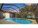 Inviting screened pool area overlooking a tranquil lake at 6223 90Th Avenue E Cir, Parrish, FL 34219