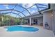 Inviting kidney-shaped pool with a screened enclosure at 6223 90Th Avenue E Cir, Parrish, FL 34219
