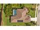 Bird's-eye view of the home, highlighting the pool and solar panels at 6223 90Th Avenue E Cir, Parrish, FL 34219
