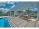 Relaxing pool area with pergola and patio furniture at 6311 Grand Oak Cir # 202, Bradenton, FL 34203