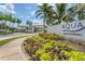 Community entrance featuring manicured landscaping, a gated entry, and the 'AQUA' community sign at 6314 Sea Lavender Dr, Bradenton, FL 34210