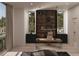 Modern home office with built-in shelving and large windows at 6489 Gulfside Rd, Longboat Key, FL 34228