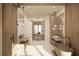 Spa-like bathroom with double vanity and freestanding tub at 6489 Gulfside Rd, Longboat Key, FL 34228