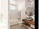 Modern bathroom with marble accents and a large vanity at 6489 Gulfside Rd, Longboat Key, FL 34228