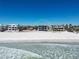 Beachfront home undergoing construction under a clear blue sky at 6489 Gulfside Rd, Longboat Key, FL 34228