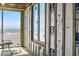 Construction of interior walls reveals framing detail, window installation, and future ocean view at 6489 Gulfside Rd, Longboat Key, FL 34228