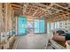 Unfinished interior with sliding glass doors offering a view of a beach at 6489 Gulfside Rd, Longboat Key, FL 34228