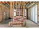 Interior home construction with exposed wood framing and large window framing at 6489 Gulfside Rd, Longboat Key, FL 34228